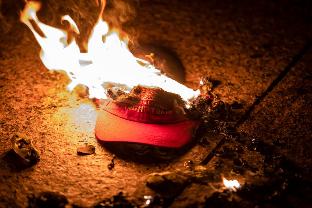Image may contain Fire Flame Bonfire Clothing Hat Baseball Cap and Cap